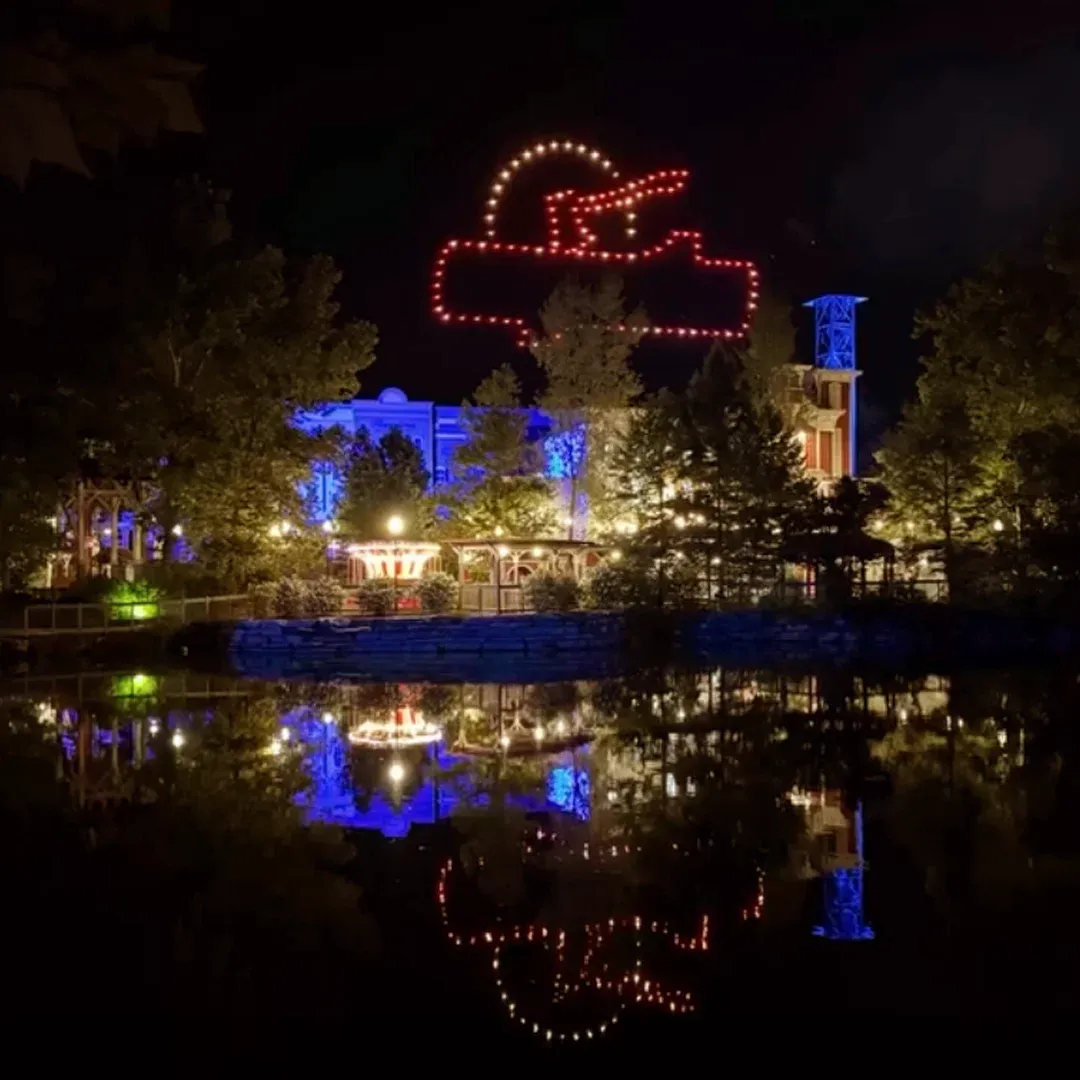 Silver Dollar City drone light show reflected over water
